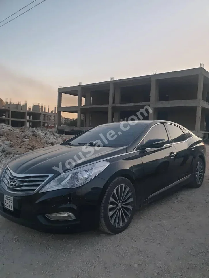 هيونداي غراندير 2012 اتوماتيك 128,000 كم 4 سلندر دفع أمامي سيدان أسود بنزين