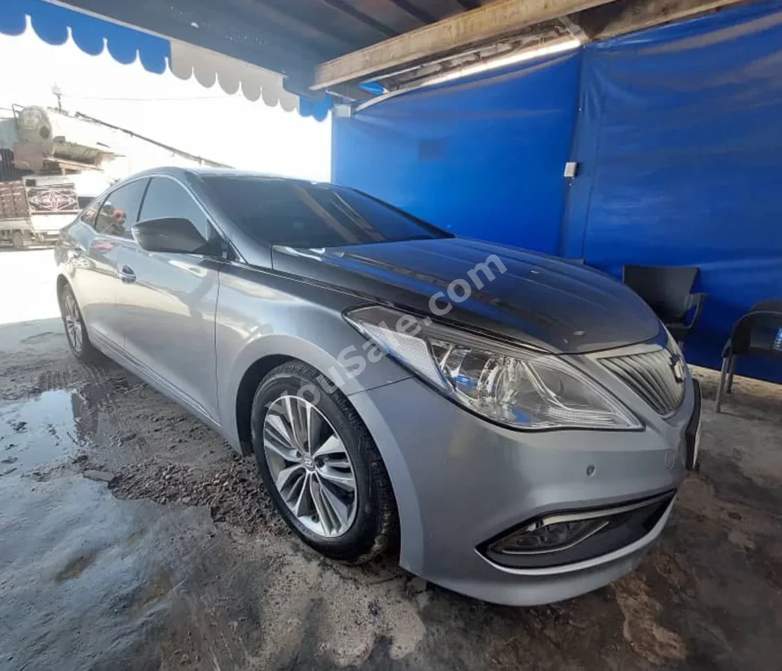 Hyundai  Grandeur  2016  Automatic  125,000 km  4 Cylinder  FWD  Sedan  Silver  Gasoline