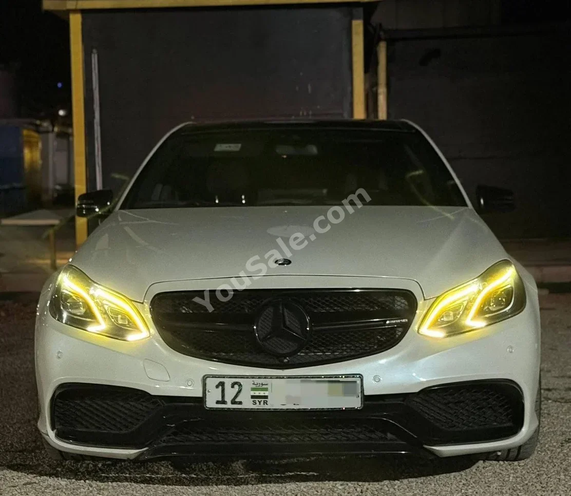 مرسيدس - بنز اي - كلاس 63 S 2014 اتوماتيك 165,000 كم 8 سلندر دفع خلفي سيدان أبيض بنزين
