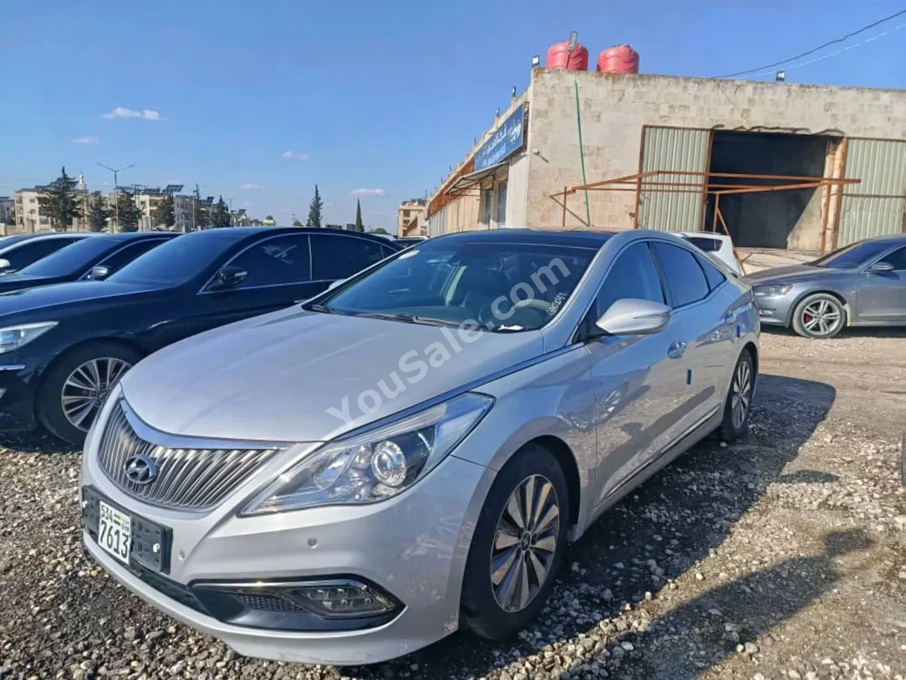 Hyundai  Grandeur  2016  Automatic  320,000 km  4 Cylinder  FWD  Sedan  Silver  Hybrid