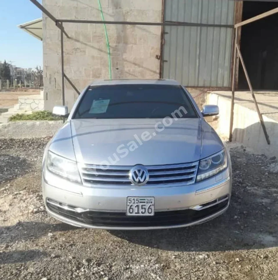 Volkswagen  Passat  2010  Automatic  229,000 km  4 Cylinder  FWD  Sedan  Silver  Diesel