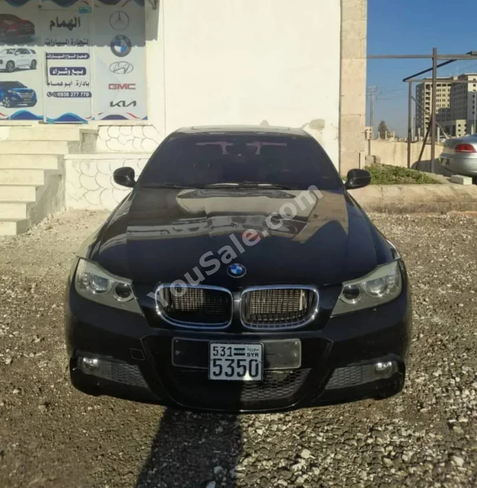 BMW  3-Series  320i  2011  Automatic  141,000 km  4 Cylinder  RWD  Sedan  Black  Gasoline