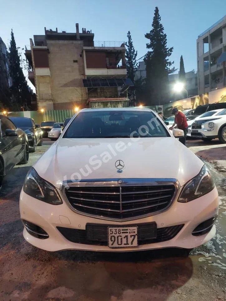 Mercedes-Benz  E-Class  200  2014  Automatic  126,000 km  4 Cylinder  RWD  Sedan  White  Gasoline