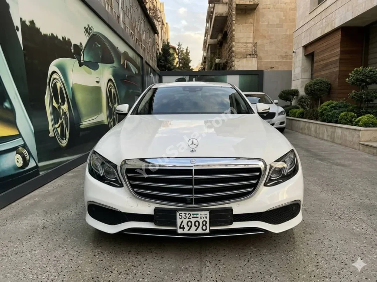 Mercedes-Benz  E-Class  300  2018  Automatic  125,000 km  4 Cylinder  4WD  Sedan  White  Gasoline