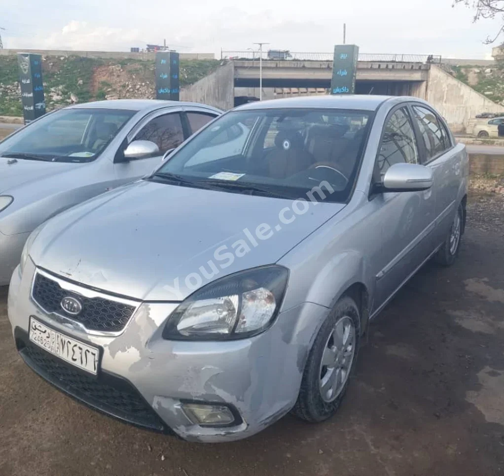 Kia  Rio  2012  Automatic  60,000 km  4 Cylinder  FWD  Sedan  Silver  Gasoline