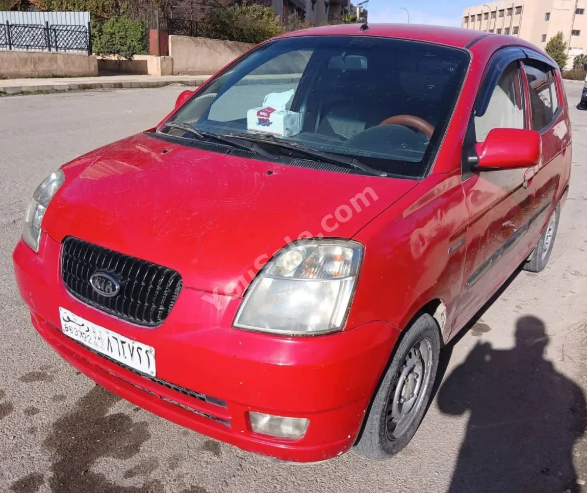 كيا بكانتو 2006 اتوماتيك 210,000 كم 4 سلندر دفع أمامي هاتشباك أحمر بنزين