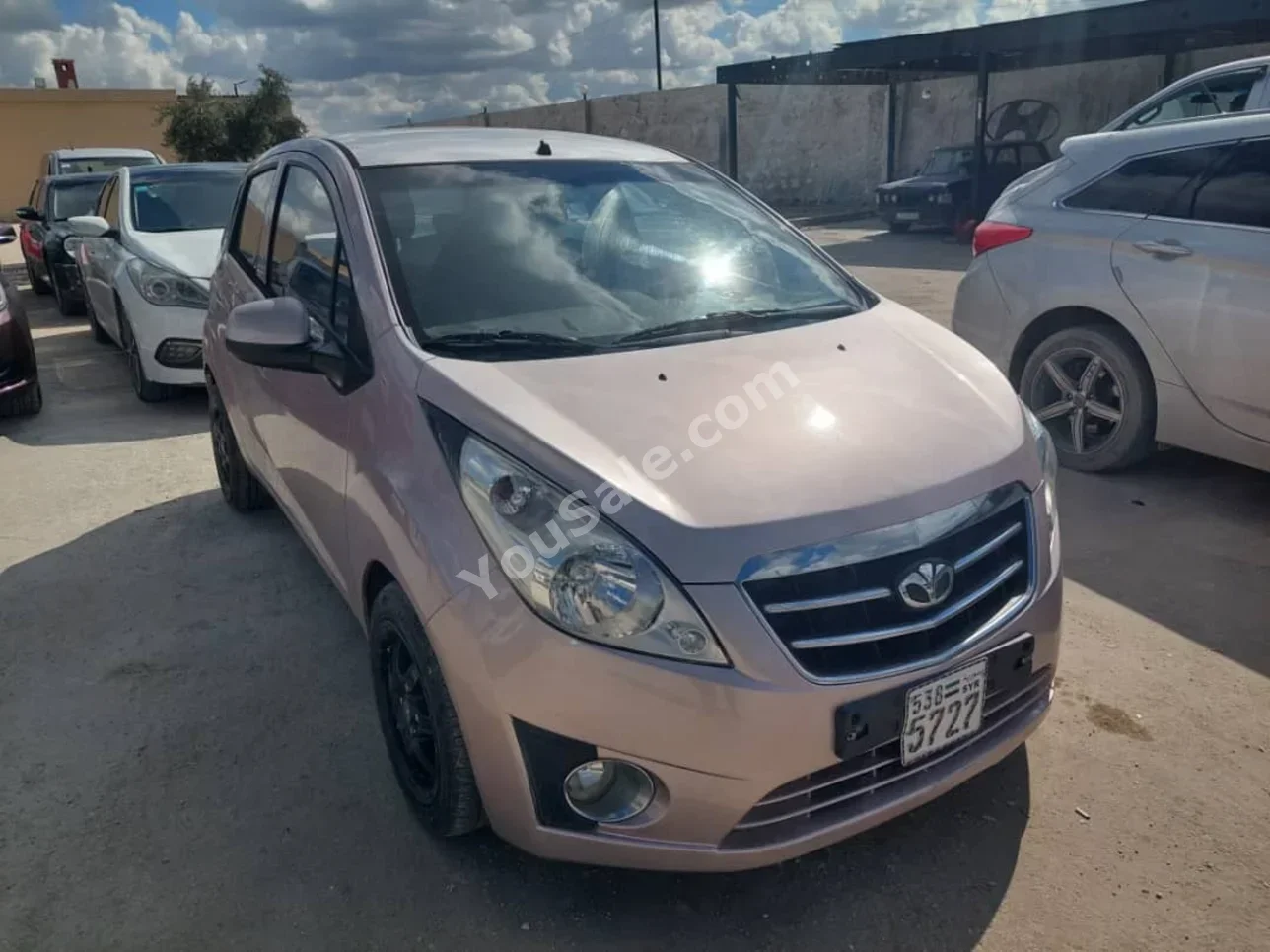 Chevrolet  Spark  2011  Automatic  165,000 km  3 Cylinder  FWD  Hatchback  Light Beige  Gasoline