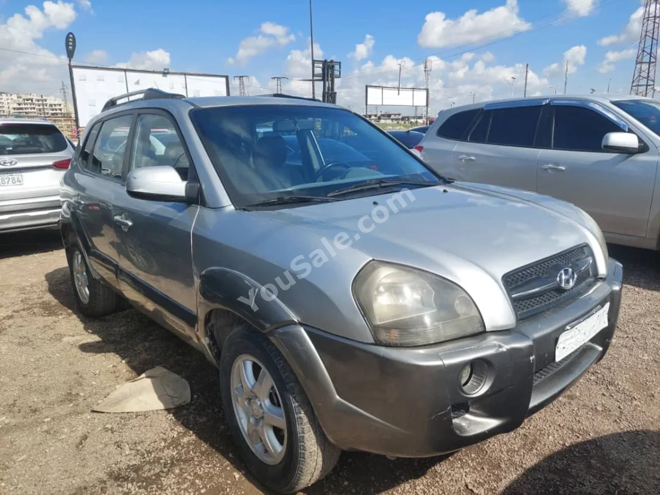 Hyundai  Tucson  2006  Automatic  184,000 km  4 Cylinder  FWD  SUV  Silver  Gasoline
