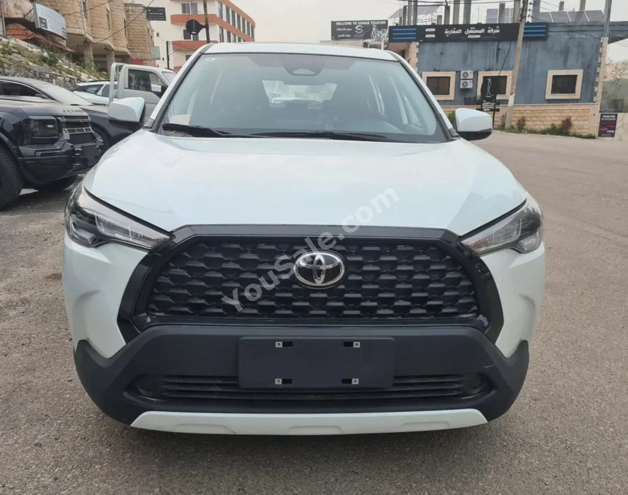 Toyota Corolla Cross 2026 Automatic 0 km 4 Cylinder FWD SUV White Hybrid