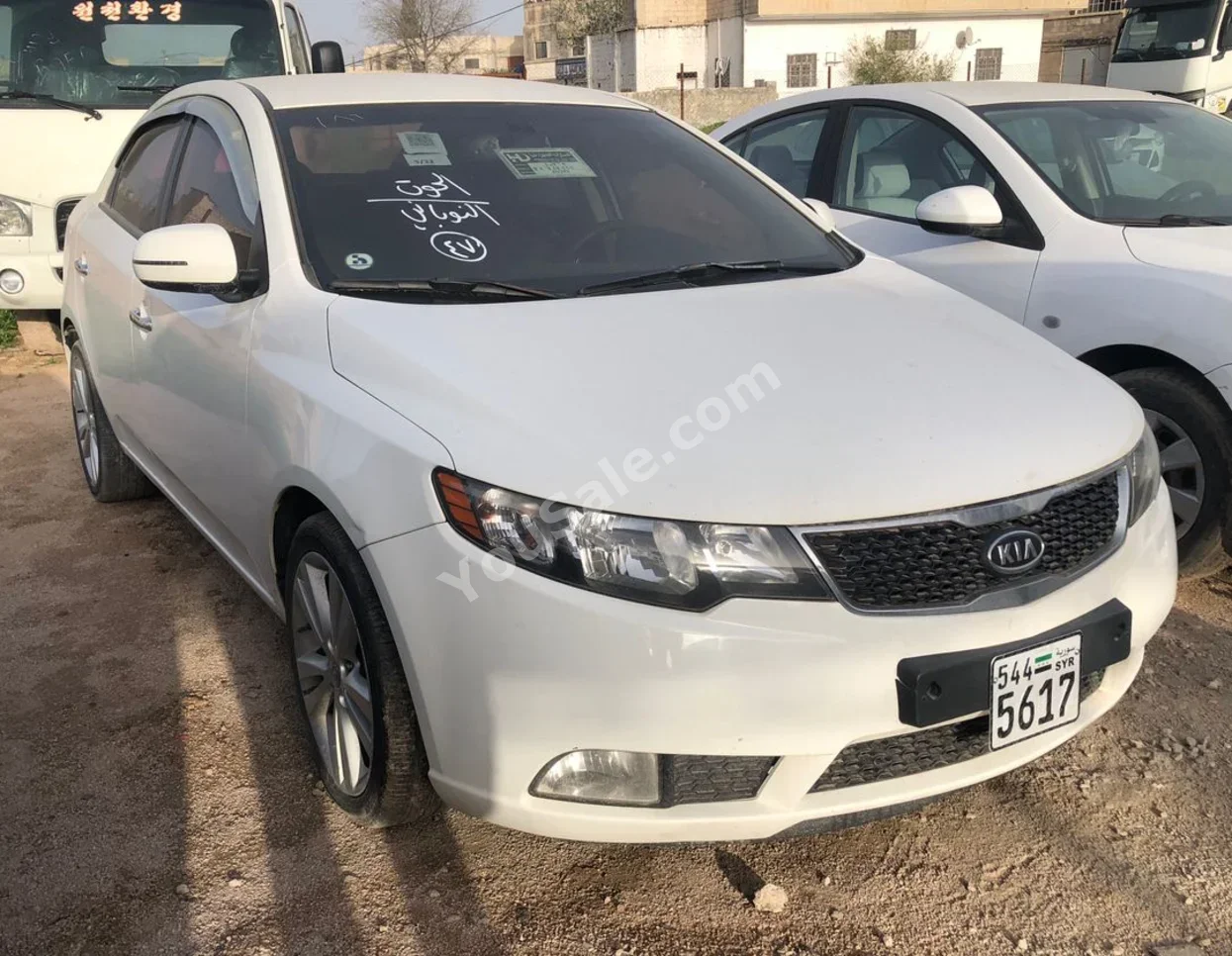 Kia  Forte  2011  Automatic  94,000 km  4 Cylinder  FWD  Sedan  White  Gasoline