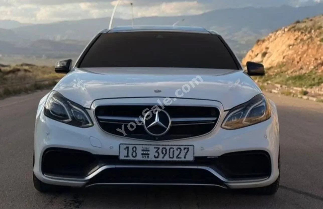 Mercedes-Benz  E-Class  63 AMG  2014  Automatic  173,000 km  8 Cylinder  4WD  Sedan  White  Gasoline