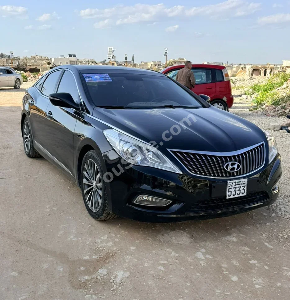 Hyundai  Grandeur  2014  Automatic  264,000 km  4 Cylinder  FWD  Sedan  Black  Gasoline
