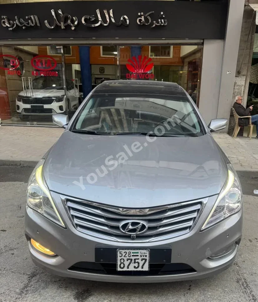 هيونداي غراندير 2011 اتوماتيك 157,000 كم 4 سلندر دفع أمامي سيدان فضي بنزين