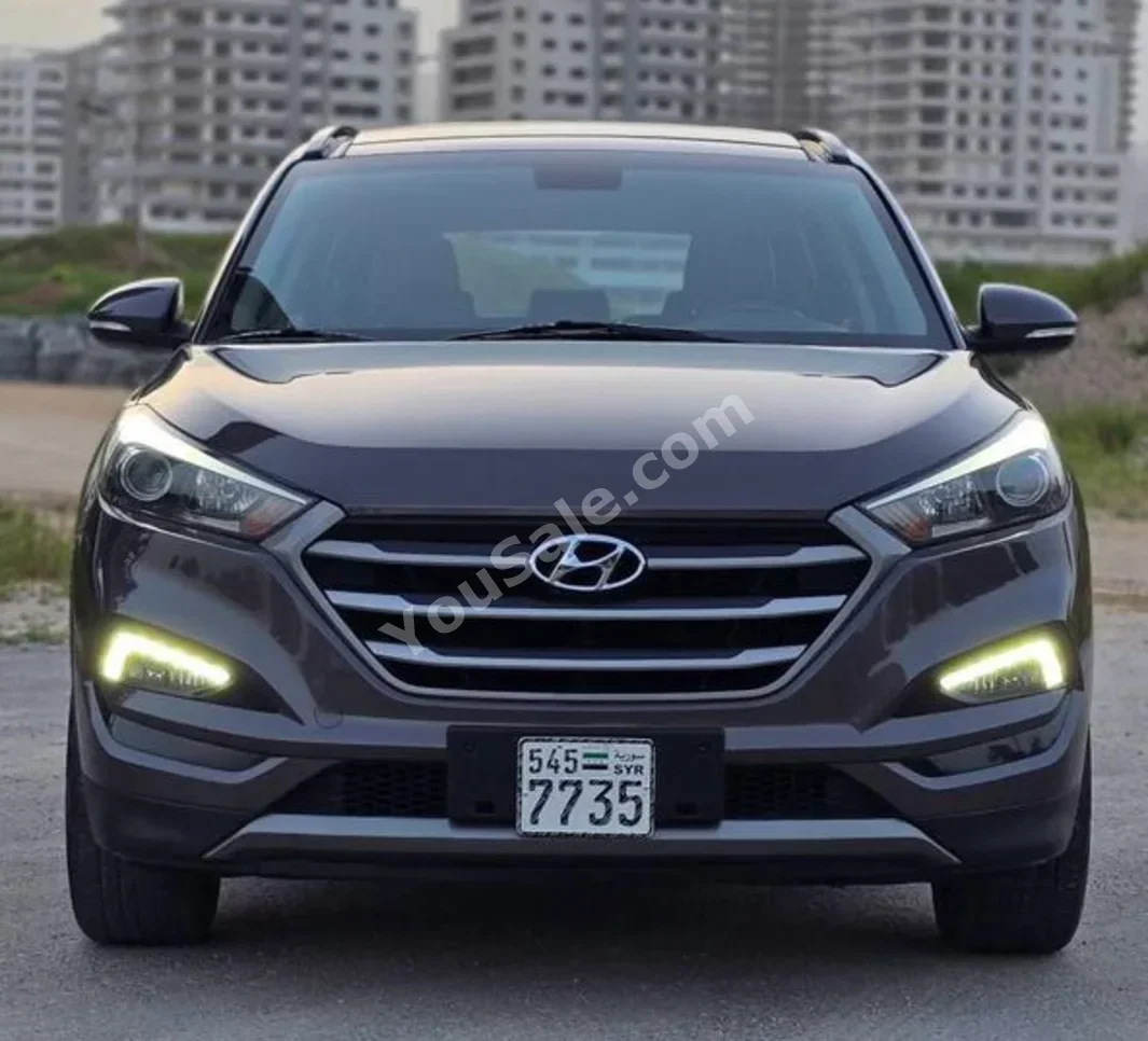 Hyundai  Tucson  2017  Automatic  100,000 km  4 Cylinder  AWD  SUV  Brown  Gasoline
