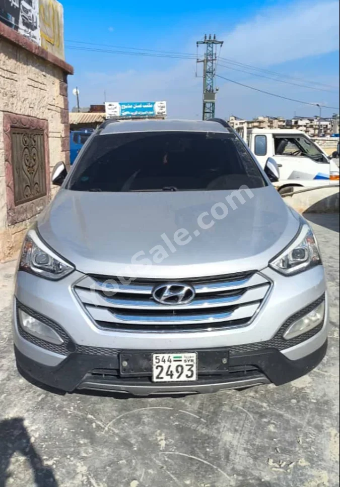 Hyundai  Santa Fe  2015  Automatic  177,000 km  4 Cylinder  FWD  SUV  Silver  Diesel