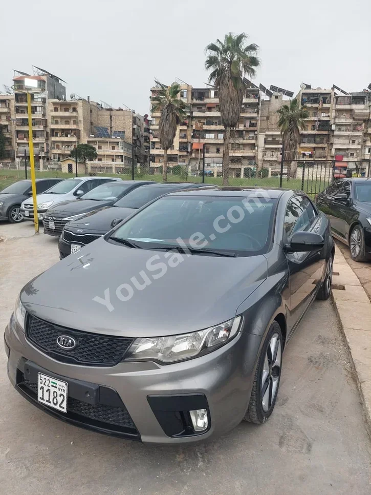 Kia  Forte  2011  Automatic  115,000 km  4 Cylinder  FWD  Coupe / Sport  Gray  Gasoline