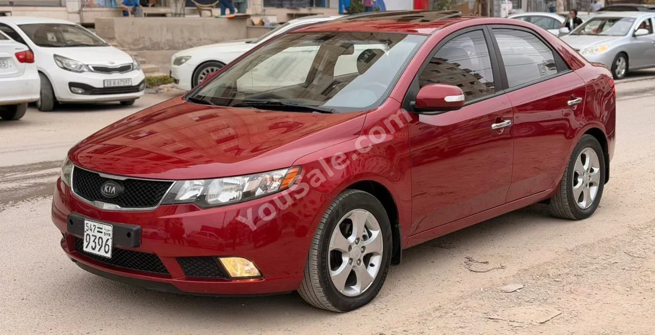 Kia Forte 2009 Automatic 66,000 km 4 Cylinder FWD Sedan Red Gasoline