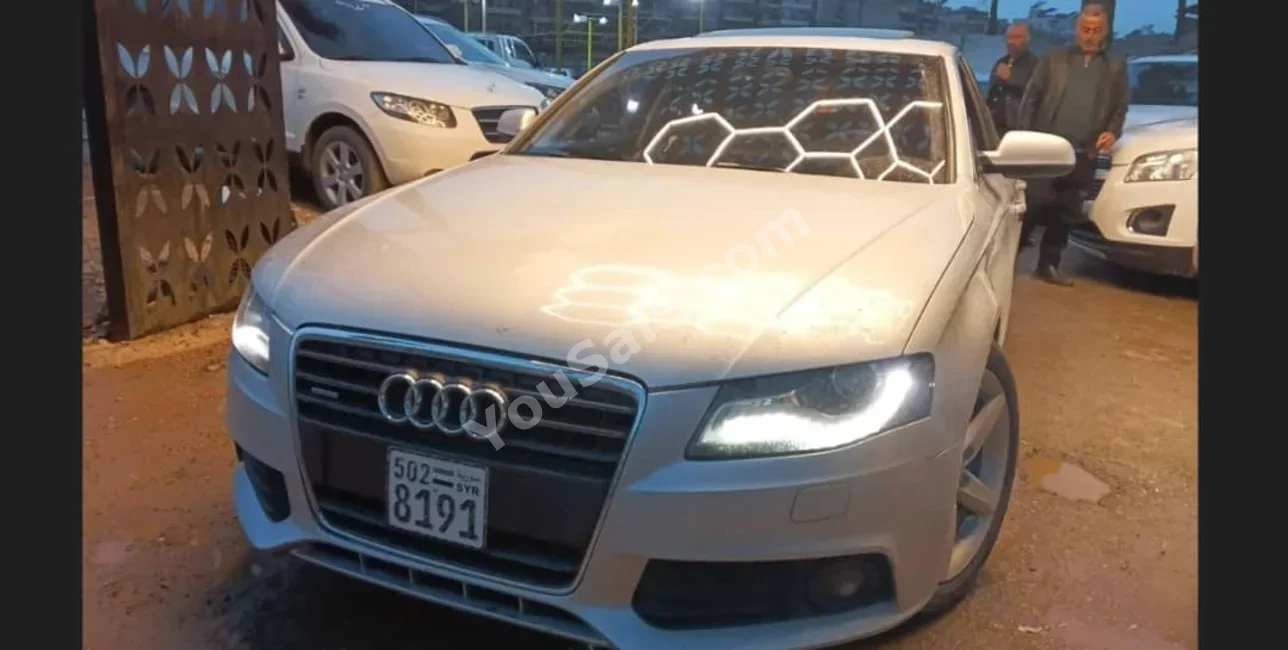 Audi  A4  2.0 T  2011  Automatic  210,000 km  4 Cylinder  4WD  Sedan  Silver  Gasoline