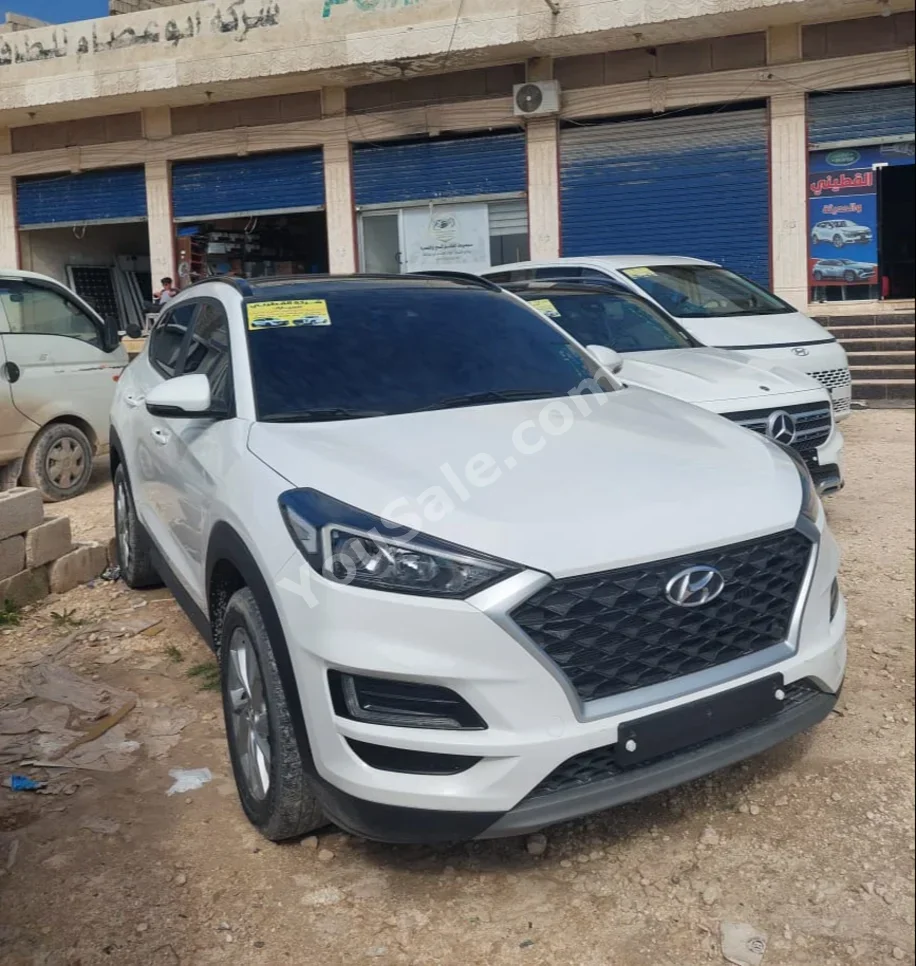 Hyundai  Tucson  2019  Automatic  73,000 km  4 Cylinder  FWD  SUV  White  Gasoline