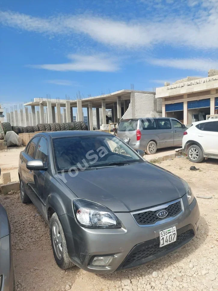 Kia  Pride  2010  Automatic  212,000 km  4 Cylinder  FWD  Sedan  Dark Gray  Gasoline