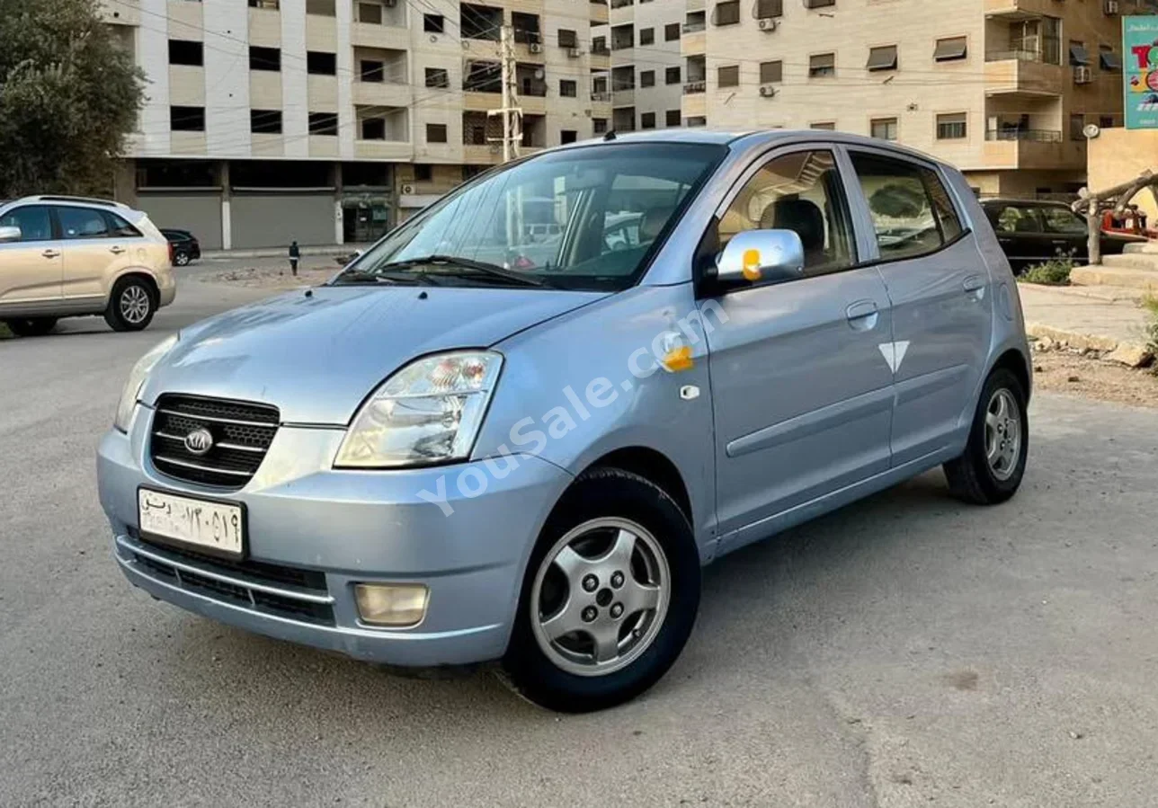 كيا بكانتو 2006 اتوماتيك 189,000 كم 4 سلندر دفع أمامي هاتشباك ازرق بنزين
