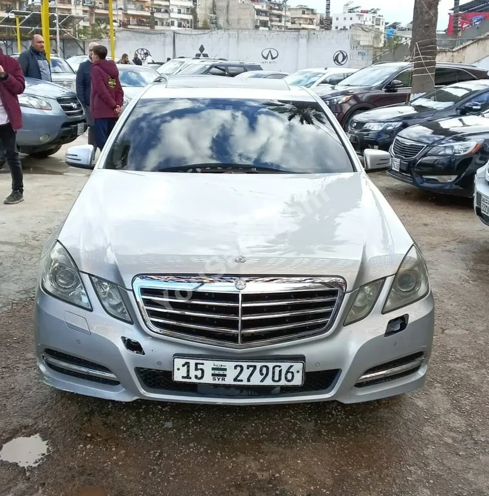 Mercedes-Benz  E-Class  220  2012  Automatic  200,000 km  4 Cylinder  RWD  Sedan  Silver  Diesel