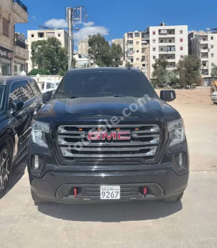 GMC  Sierra  AT4  2021  Automatic  57,000 km  8 Cylinder  4WD  Pick Up  Black  Gasoline