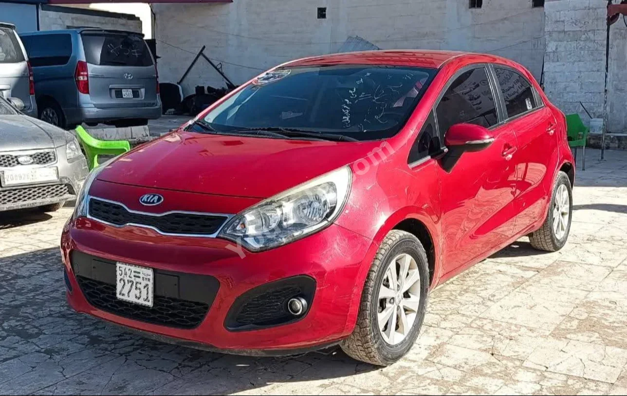Kia Rio 2014 Automatic 146,000 km 4 Cylinder FWD Hatchback Red Gasoline