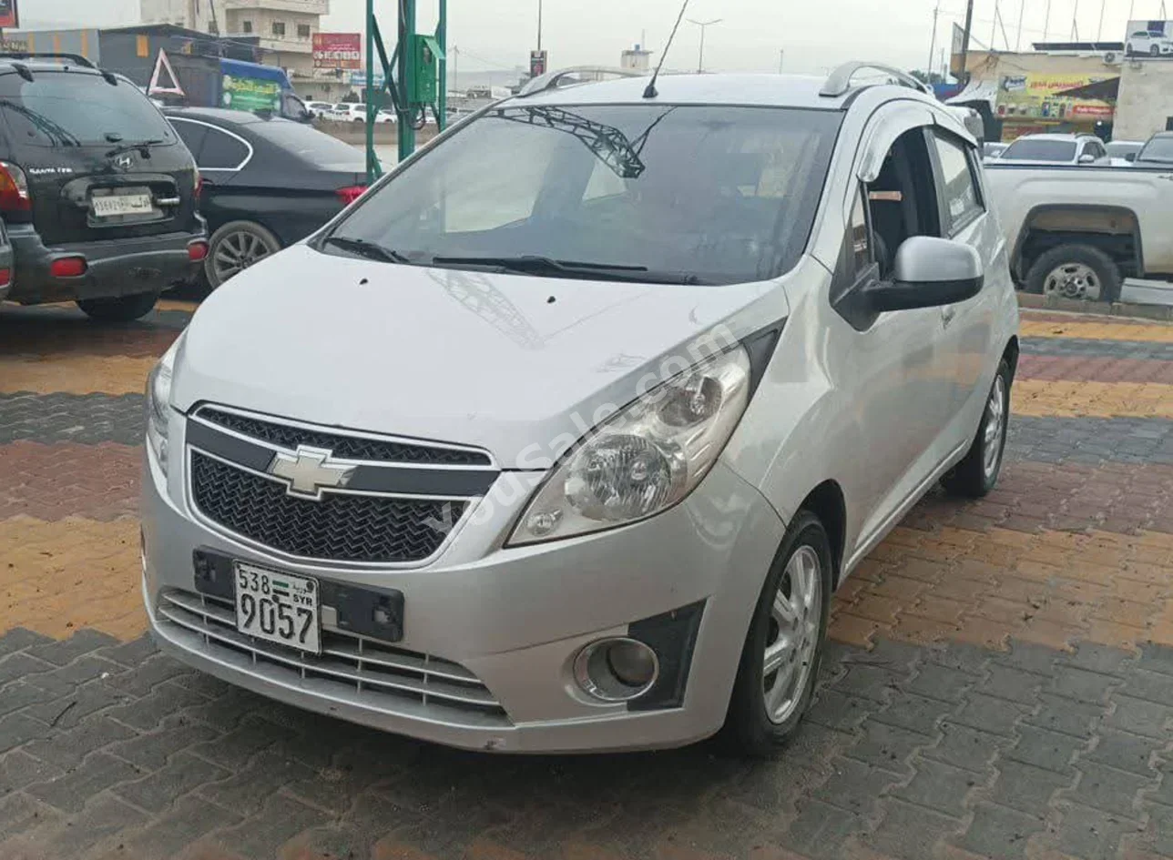 Chevrolet Spark 2012 Automatic 210,000 km 4 Cylinder FWD Hatchback Silver Gasoline