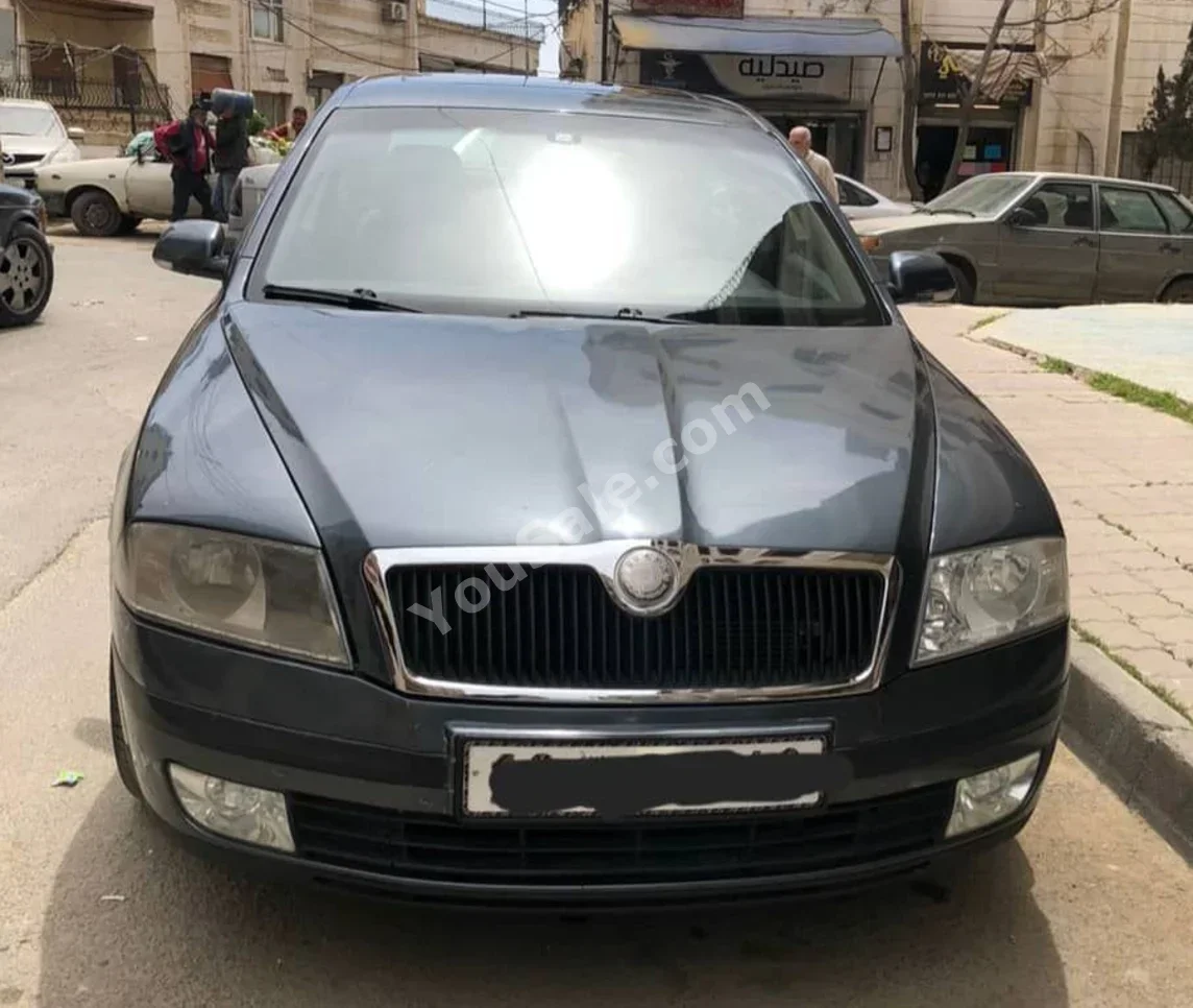 سكودا أوكتافيا 2006 اتوماتيك 195,000 كم 4 سلندر دفع أمامي سيدان رمادي بنزين