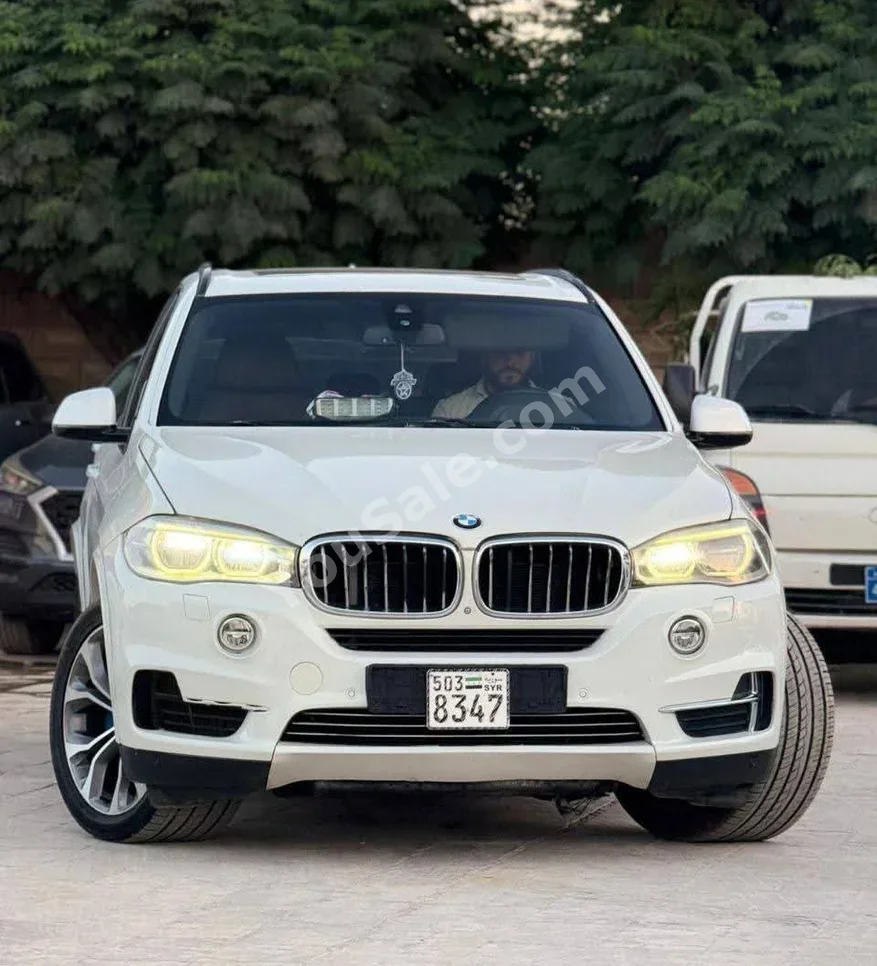 بي ام دبليو  الفئة - اكس  5  2014  اتوماتيك  209,000 كم  8 سلندر  دفع رباعي  اس يو في  أبيض  بنزين