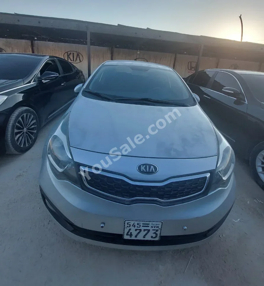 Kia  Pride  2013  Automatic  210,000 km  4 Cylinder  FWD  Sedan  Silver  Gasoline