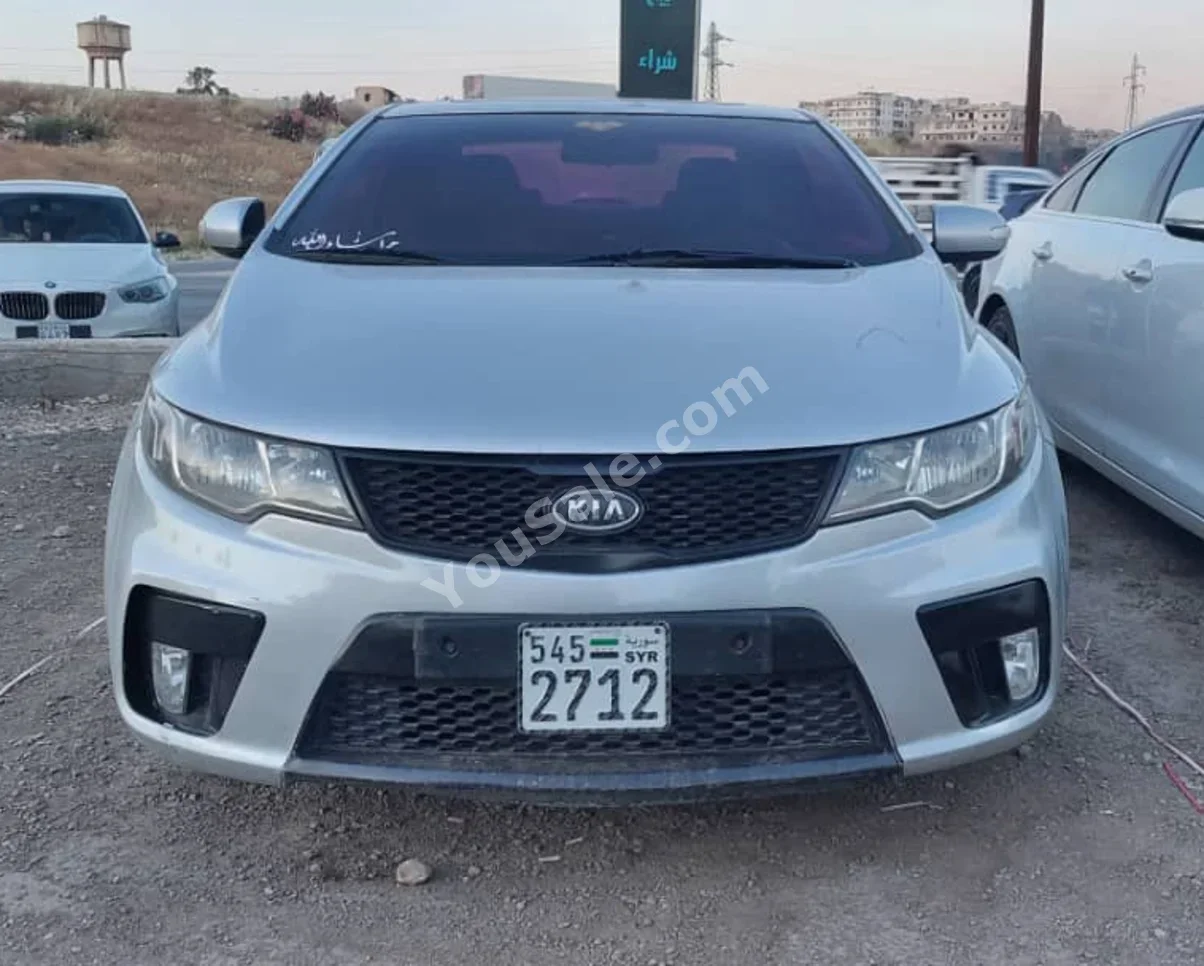 Kia Forte 2010 Automatic 183,000 km 4 Cylinder FWD Coupe / Sport Silver Gasoline