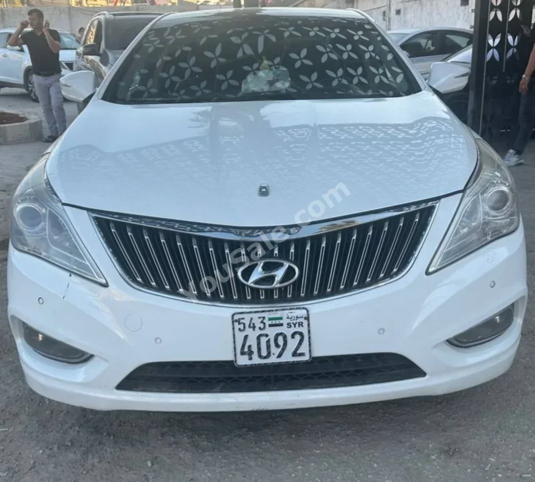 Hyundai  Grandeur  2012  Automatic  125,000 km  6 Cylinder  FWD  Sedan  White  Gasoline