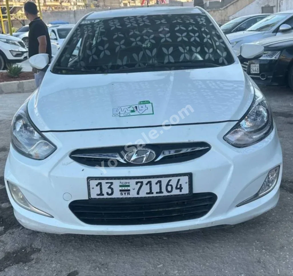 Hyundai Accent 2014 Automatic 165,000 km 4 Cylinder FWD Hatchback White Diesel