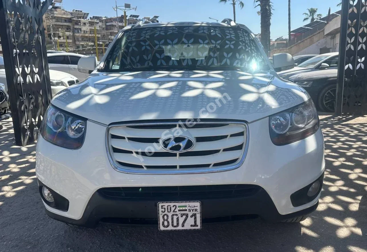 Hyundai  Santa Fe  2010  Automatic  148,000 km  4 Cylinder  FWD  SUV  White  Diesel