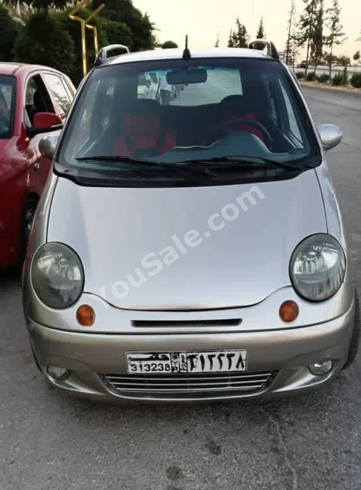 Daewoo  Matiz  2004  Automatic  214,000 km  4 Cylinder  FWD  Hatchback  Silver  Gasoline