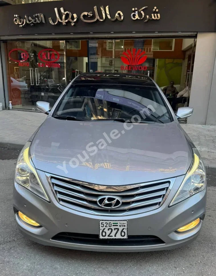 Hyundai  Grandeur  2012  Automatic  184,000 km  4 Cylinder  FWD  Sedan  Silver  Gasoline