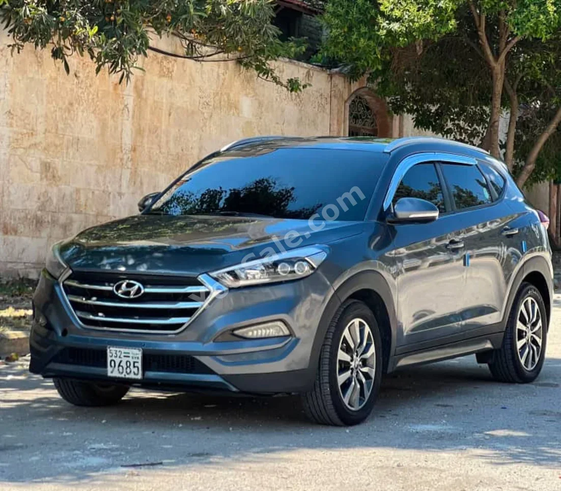 Hyundai  Tucson  2016  Automatic  144,000 km  4 Cylinder  FWD  SUV  Gray  Gasoline