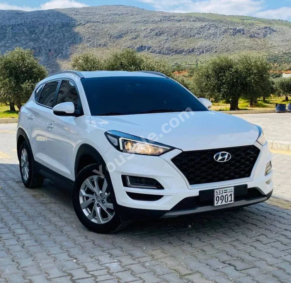 Hyundai  Tucson  2019  Automatic  166,000 km  4 Cylinder  FWD  SUV  White  Diesel