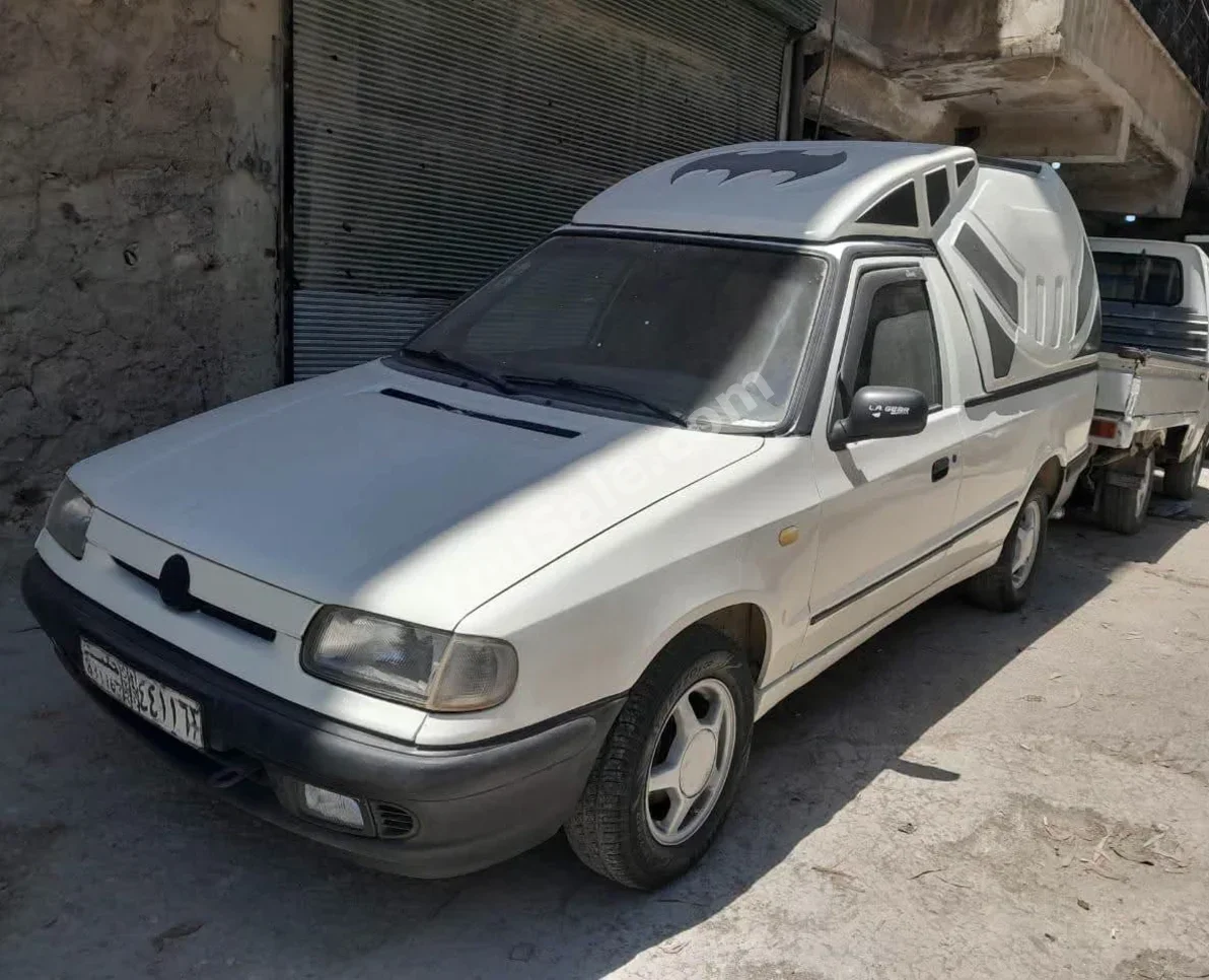 سكودا  رابيد  1999  عادي  535,000 كم  4 سلندر  دفع أمامي  بيكب  أبيض  بنزين
