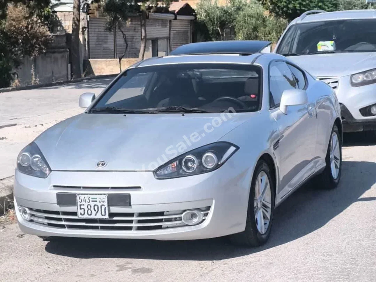 Hyundai  Coupe FX  2009  Automatic  102,000 km  4 Cylinder  FWD  Coupe / Sport  Silver  Gasoline