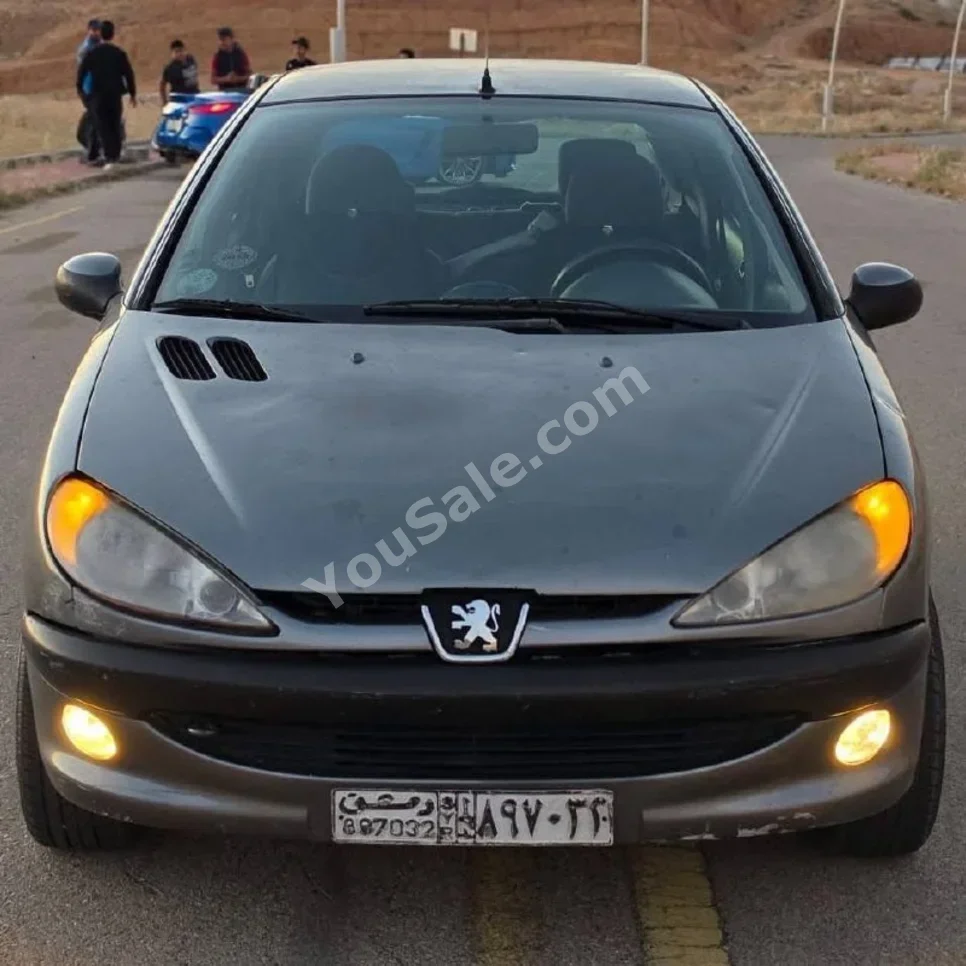 Peugeot  206  2006  Automatic  320,000 km  4 Cylinder  FWD  Hatchback  Gray  Gasoline