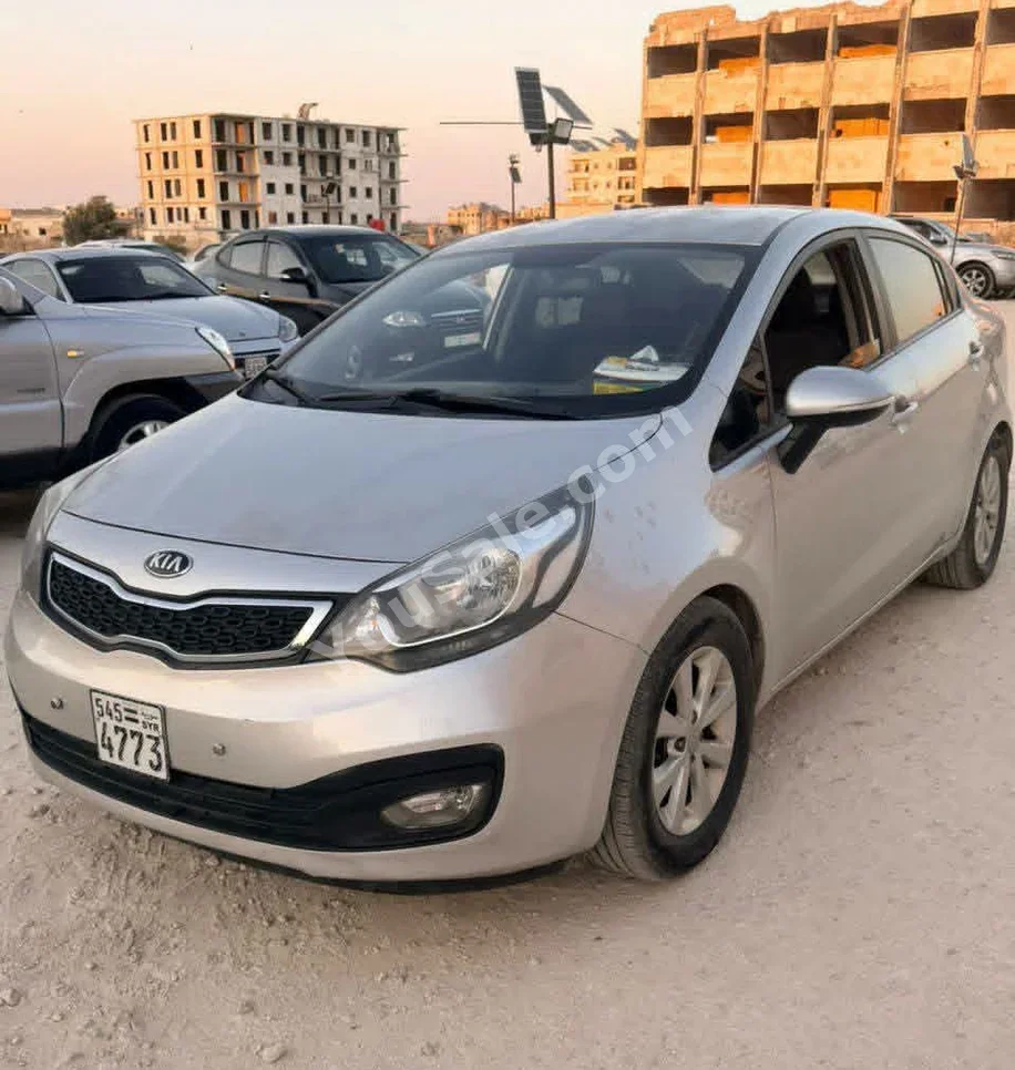 Kia  Pride  2013  Automatic  125,000 km  4 Cylinder  FWD  Sedan  Silver  Gasoline