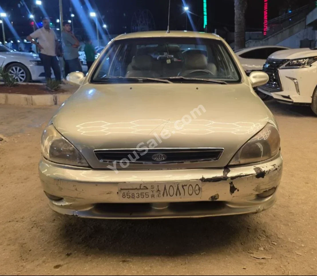 Kia  Rio  2002  Manual  244,000 km  4 Cylinder  FWD  Sedan  Light Gold  Gasoline
