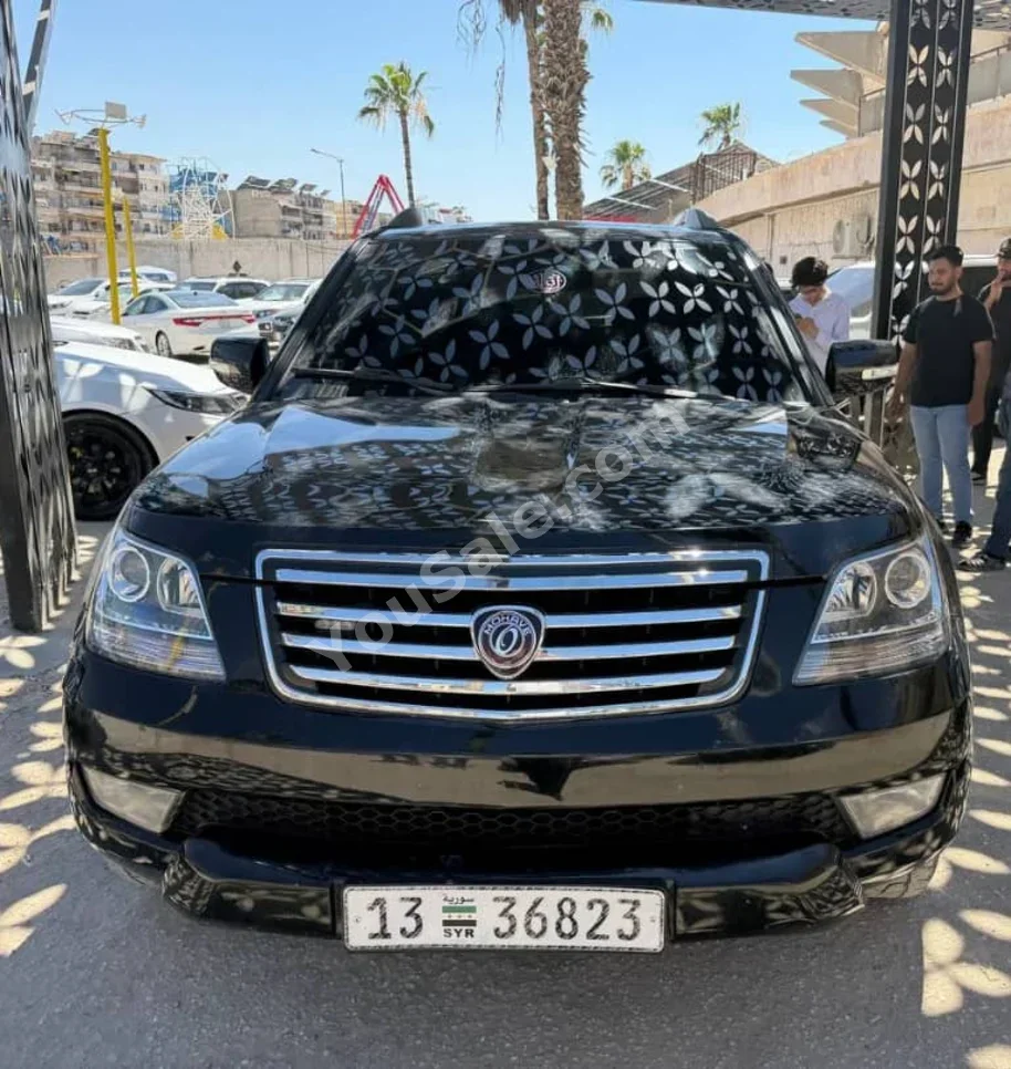كيا موهافي 2008 اتوماتيك 156,000 كم 6 سلندر دفع خلفي اس يو في أسود ديزل