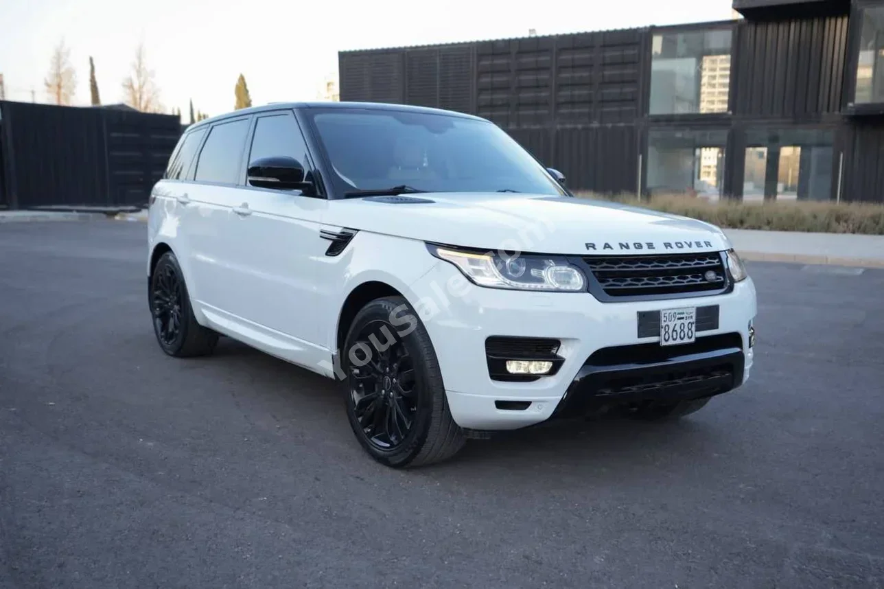 Land Rover  Range Rover  Sport  2014  Automatic  98,000 km  6 Cylinder  AWD  SUV  White  Gasoline