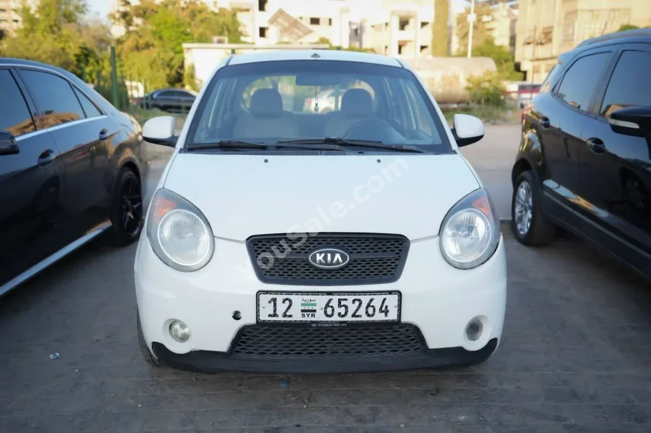Kia  Picanto  2010  Automatic  122,000 km  4 Cylinder  FWD  Hatchback  White  Gasoline