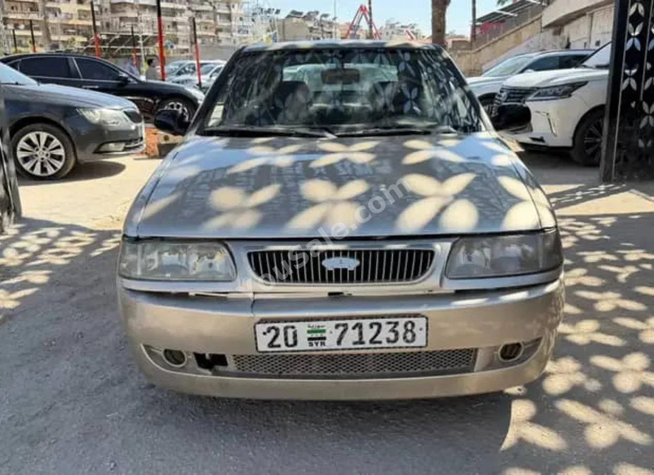 شيري شيري 2003 عادي 210,000 كم 4 سلندر دفع أمامي سيدان ذهبي فاتح بنزين